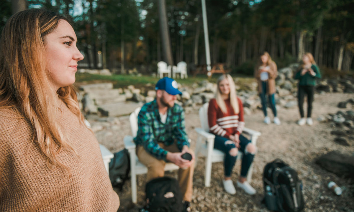 Business Programs 4 Saint Joseph's College of Maine students hang out down at the campus lakefront.