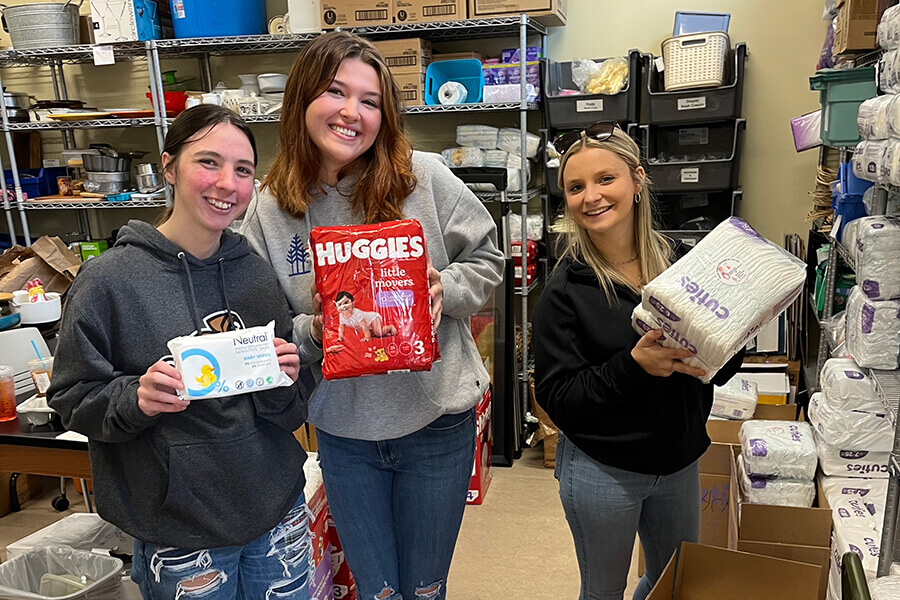 Community Service 7 Service: Social work students volunteer at a diaper drive