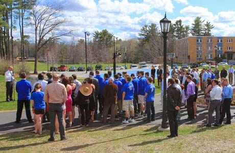 SJC community listens as athletic director Brian Curtin speaks at the plaque dedication.