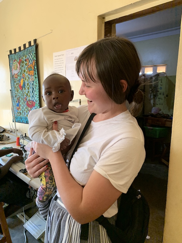April Benak’s experience participating in an Ugandan medical mission over winter break 3 April Benak working with a baby in Uganda