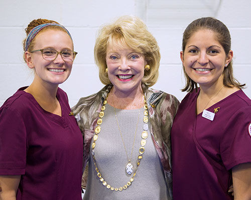 Jeanne Arnold with two nursing students