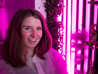 Community-Based Learning 1 science student works in the freight farm