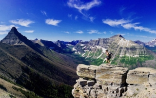 Trail Magic 3 Effie stands on a mountaintop with a beautiful vista