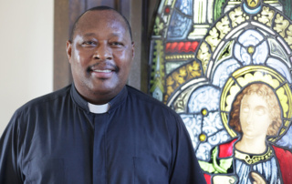 Photo of Father Gabriel in Xavier Hall
