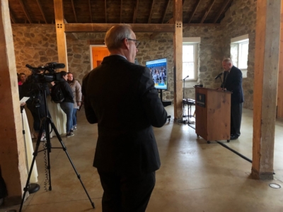 President Dlugos leading a prayer in the Stone Barn