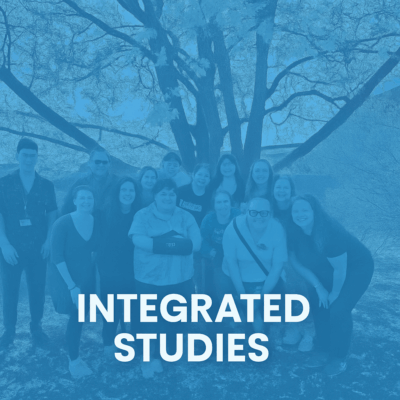 Academic Center For Excellence 17 A group of people poses in front of a tree outdoors with the words Integrated Studies overlaid at the bottom of the image. Saint Joseph's College of Maine