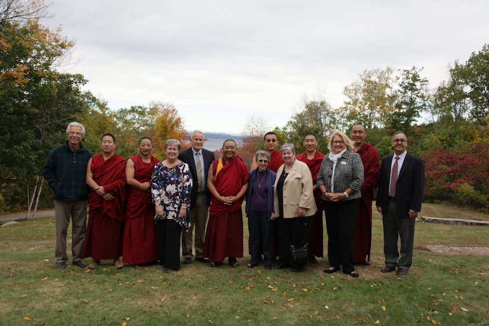 Healing The Earth 3 Members of the Center for Faith and Spirituality planning committee stand with Monks in front of Sebago Lake.
