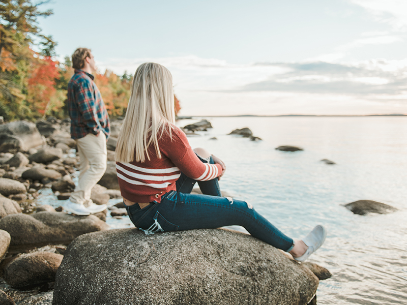 Students at the lakefront in fall