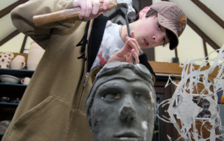 Creative Suite 10 Fine arts student sculpting