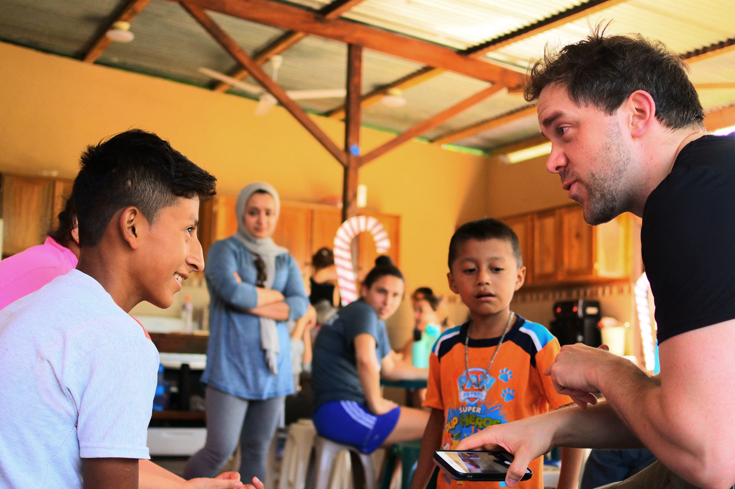 Theology Programs 1 Student talks with area children during international service trip to Guatemala.