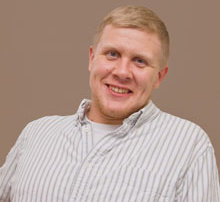 Talk With Andrew Wasowski ’11 9 A person with short blonde hair wearing a white and grey striped shirt, smiling in front of a beige background, looks ready to talk just like Andrew Wasowski. Saint Joseph's College of Maine