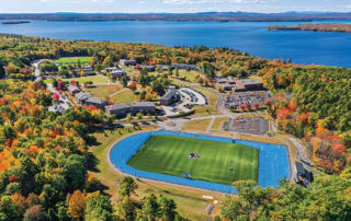 Game Changers: Change Is In The Air 8 drone shot in fall of campus showing the athletic turf field