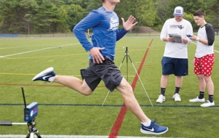 Mind, Body, Soul 5 exercise science students in the field tracking running rate