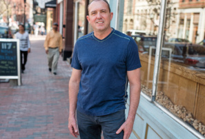 On Finding Balance 7 Lee Kennedy poses in a blue shirt on a city street