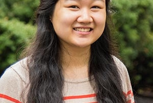Nhu Vo ’17 Named Heart And Soul Award Recipient, Honored With Tree Planting On Saint Joseph’s College Campus 8 A young woman with long, dark hair wearing a beige and red striped sweater smiles outdoors with greenery in the background at Saint Joseph’s College, where she recently received the Heart and Soul Award. Saint Joseph's College of Maine