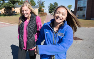 Admissions Office Hosts Summer Open House On August 2 5 Female students laughing together at Saint Joseph's College of Maine