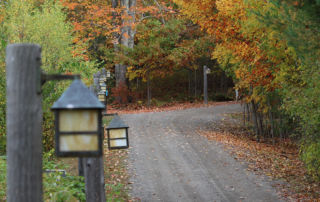 walking path down to the lake with fall foliage