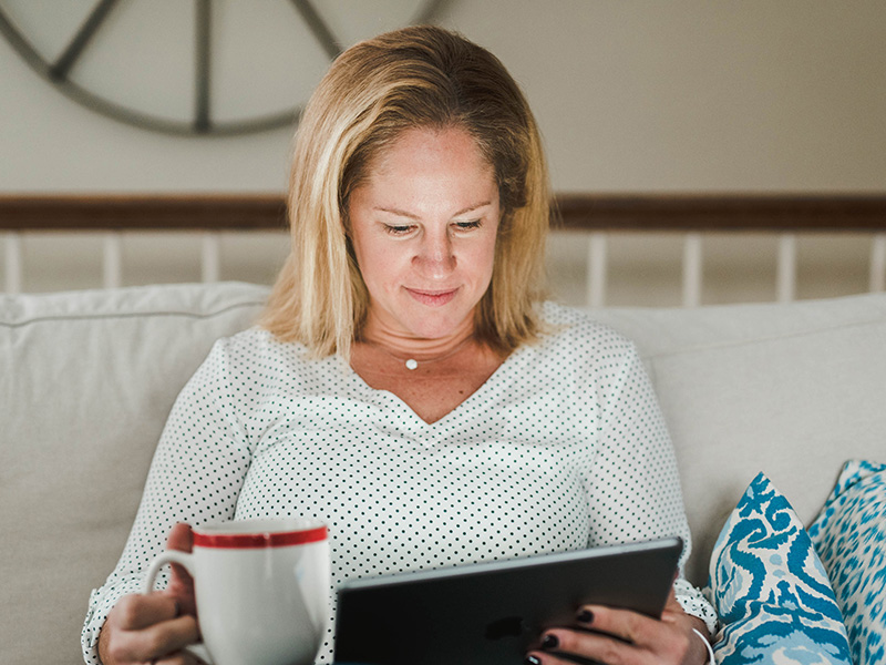 Woman-Tablet Woman reading from a tablet